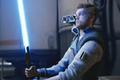 Cal Kestis igniting his lightsaber in Star Wars Jedi Survivor