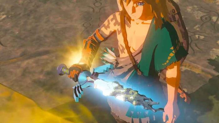 Link holding the Master Sword weapon in Zelda Tears of the Kingdom.