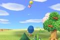 Animal Crossing New Horizons. The player is aiming up at a floating gift. The balloon is yellow. There is a cherry tree on the right of the image.