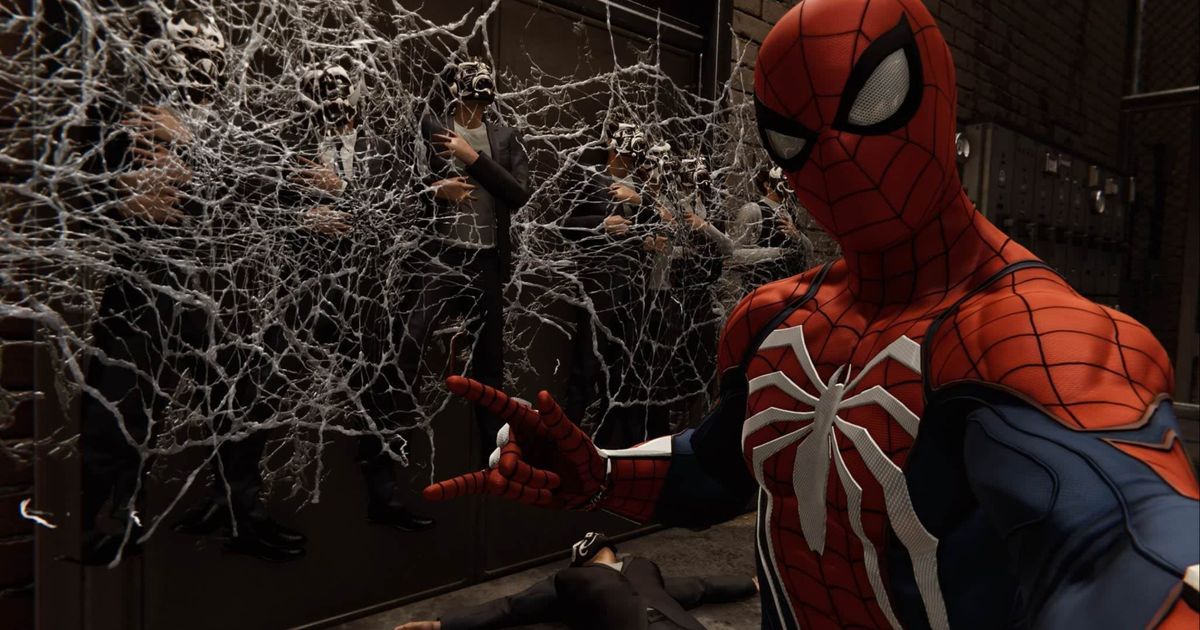 Spider-man posing for a selfie in front of enemies that have been stuck to a wall with webs