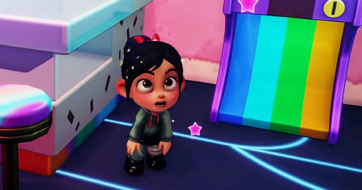 Disney Dreamlight Valley - Vanellope with her mouth open, stood next to a rainbow slide