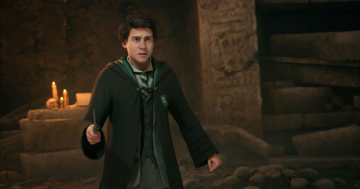 A Slytherin wizard holding a wand in Hogwarts Legacy.