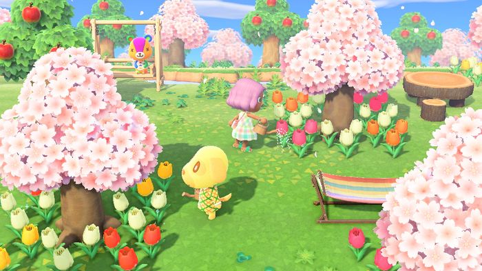 A player watering flowers with villager Goldie, who has a December birthday in Animal Crossing: New Horizons.