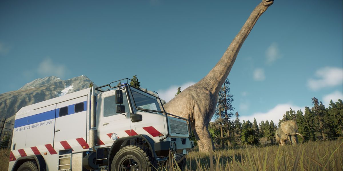 Jurassic World Evolution 2 Mobile Vet Unit on the left of the screen with a Brachiosaurus behind it. There is a Nasutoceratops in the background. All dinosaurs are sick and in quarantine.