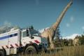 Jurassic World Evolution 2 Mobile Vet Unit on the left of the screen with a Brachiosaurus behind it. There is a Nasutoceratops in the background. All dinosaurs are sick and in quarantine.