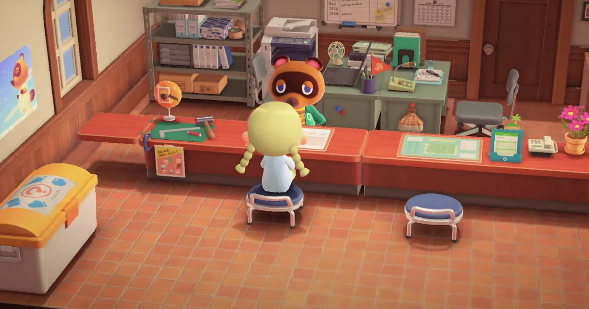 The Resident Representative is talking to Tom Nook at the Construction Desk in the Town Hall.