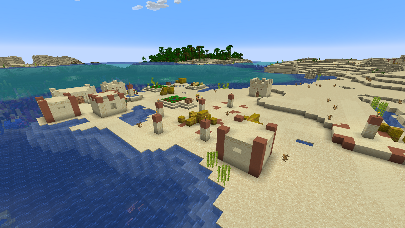 A Minecraft village in the desert, beside the ocean.