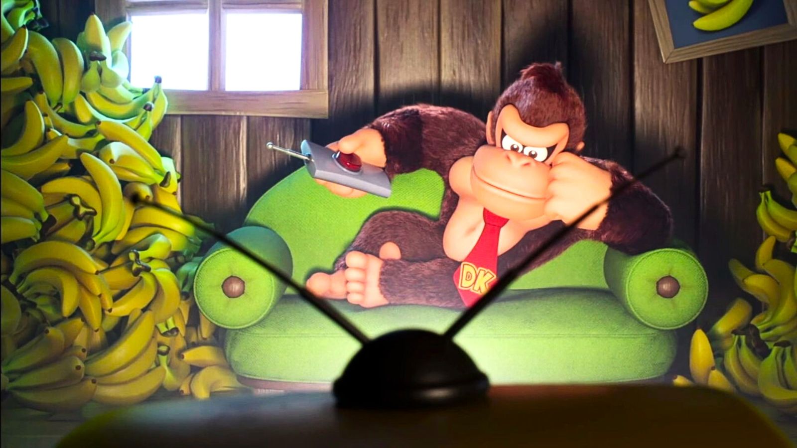 Donkey Kong watching tv surrounded by bananas
