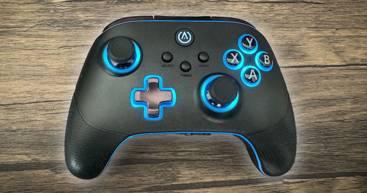 A black controller with blue lighting around the trim of the controller as well as the buttons.