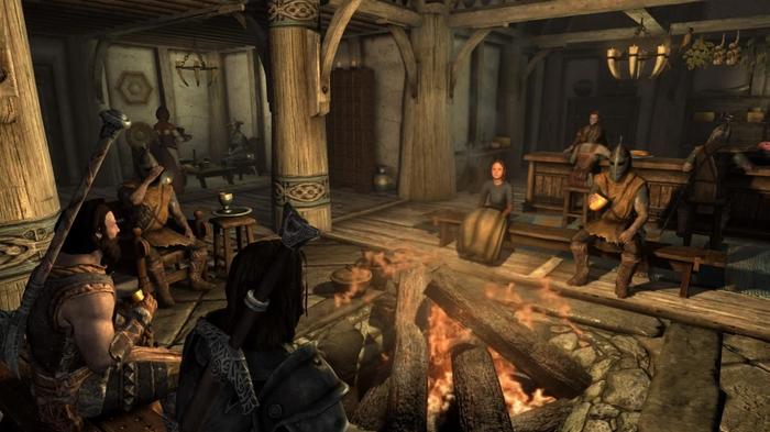 A group of Skyrim NPC's in a tavern in Whiterun