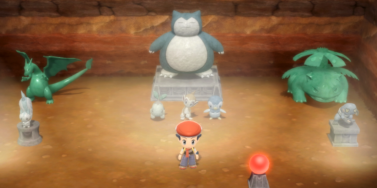 A Pokémon Trainer amongst statues and shiny statues in their Secret Base inside the Grand Underground of Pokémon Brilliant Diamond and Shining Pearl, where many evolution stones can be found.