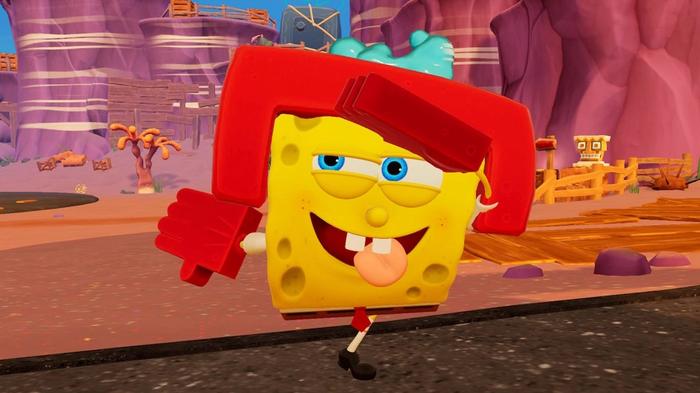 SpongeBob wearing a head protector and karate gloves with his tongue out in SpongeBob SquarePants: The Cosmic Shake.