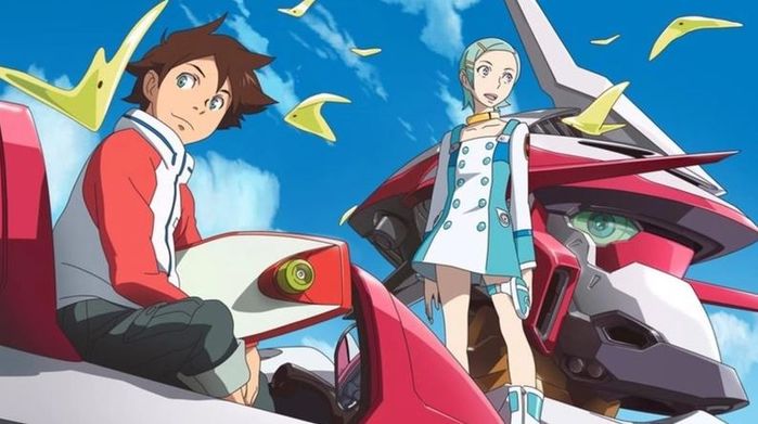 A young boy and girl sit on top of a huge, white and red mecha.