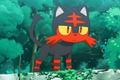 Pokemon Go Litten standing with trees in background