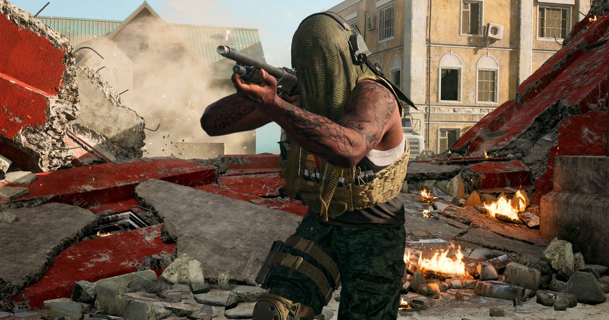 Warzone player aiming with gun with destroyed building in background