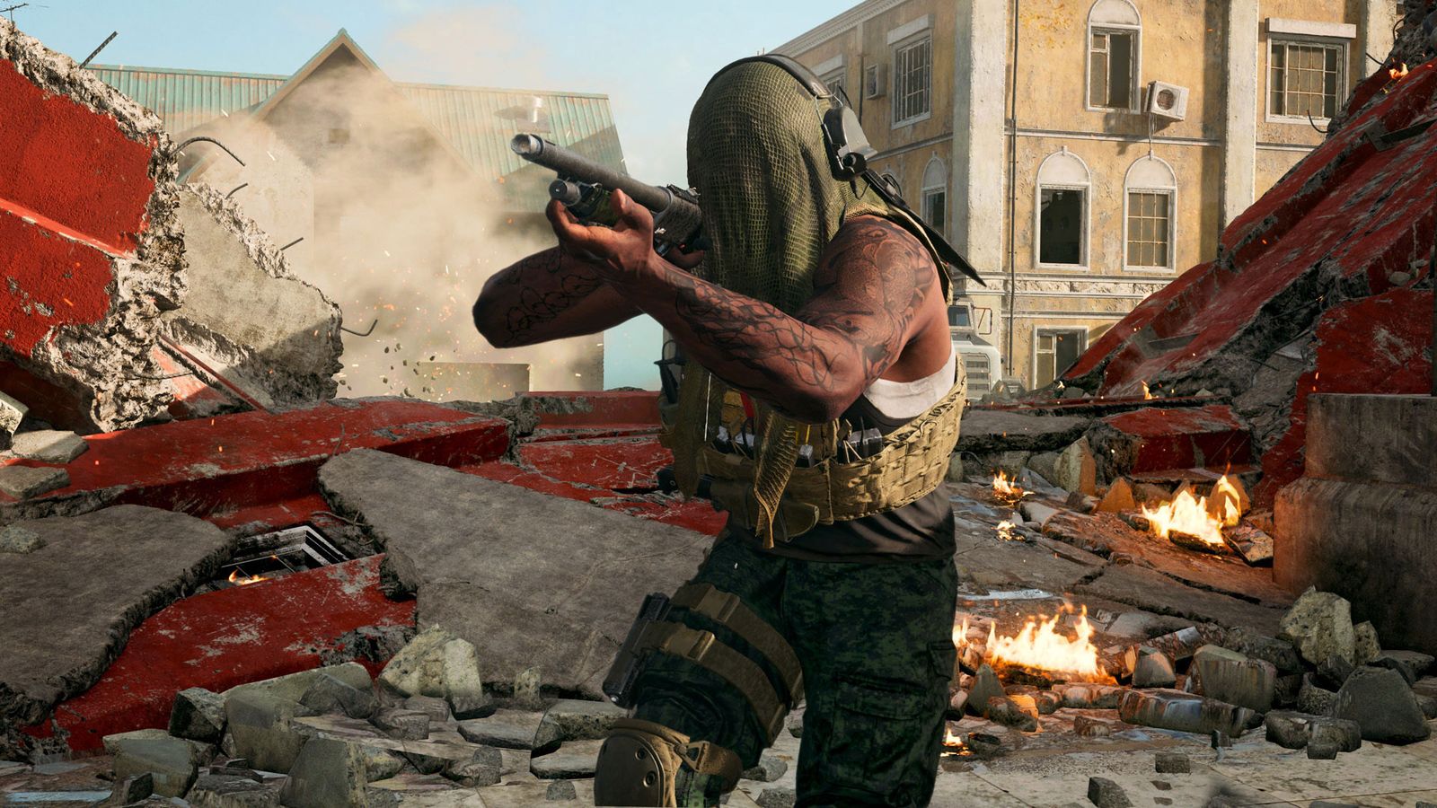 Warzone player holding shotgun with destroyed Rebirth Island building in background