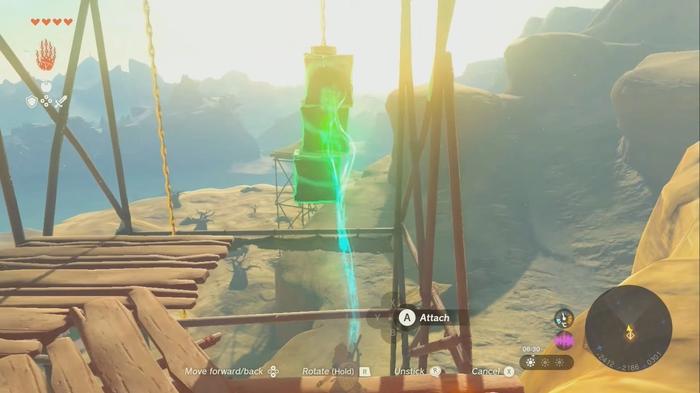 A screenshot of Link attaching the metal crates to the Gerudo Canyon Skyview Tower in Zelda Tears of the Kingdom. 