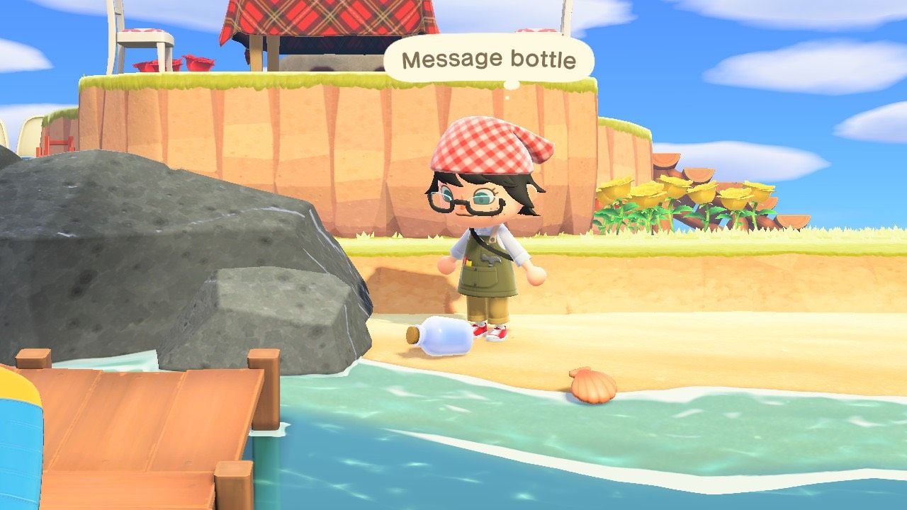 A player looking at a Message Bottle washed up on the beach of their island in Animal Crossing: New Horizons.