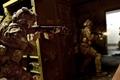 Modern Warfare 2 players firing at enemy in doorway