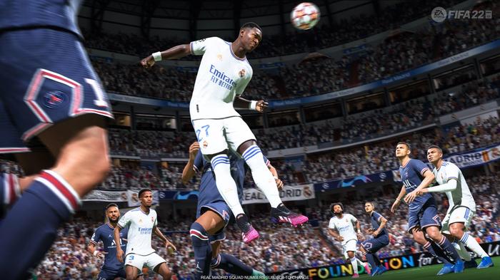 FIFA 22 screenshot showing a Real Madrid player heading the ball against Paris Saint Germain.