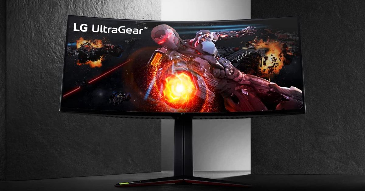 A black ultrawide monitor with red trim featuring an Iron Man-like character firing a weapon out of their hand on their display.