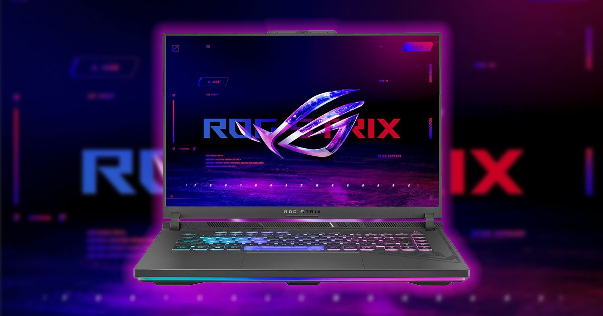 A light gray gaming laptop with blue, purple, and pink lighting behind the keys to match the ROG STRIX branding on the display.