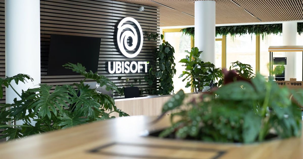 ubisoft office reception in france with green plants and logo on wall