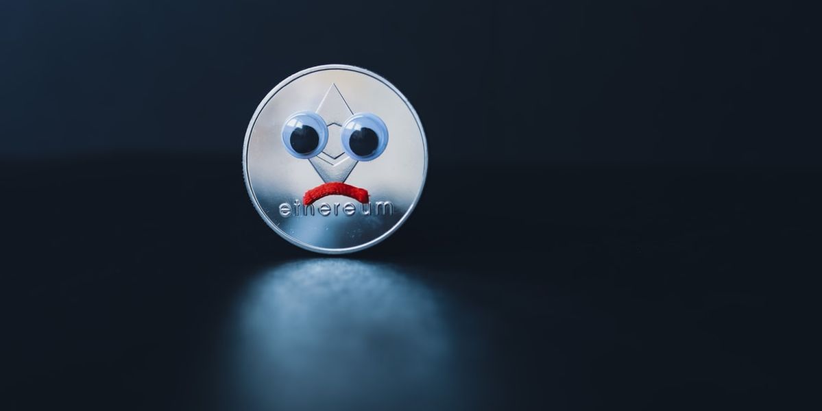 Image of an Ethereum coin with a sad face, due to the cryptocurrency prices being down.