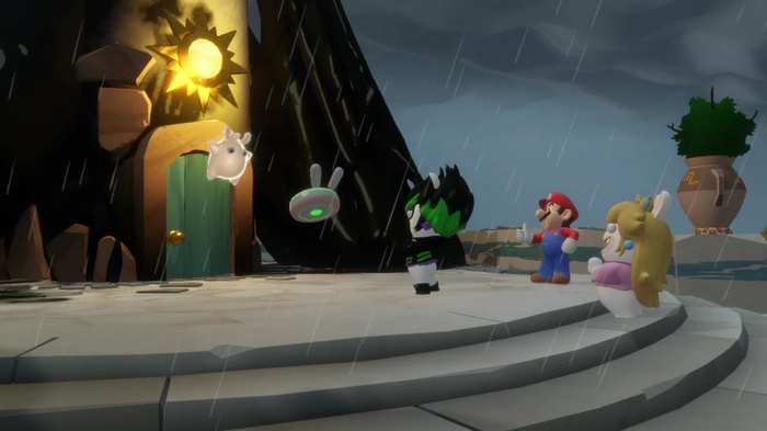 Image of a team stood in front of a glowing door in Mario and Rabbids Sparks of Hope.