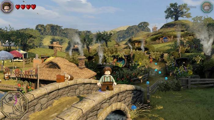 Frodo exploring Hobbiton in LEGO The Lord of the Rings: The Video Game.