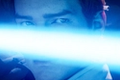 A blue lightsaber flashes across protagonist, Cal's, face.