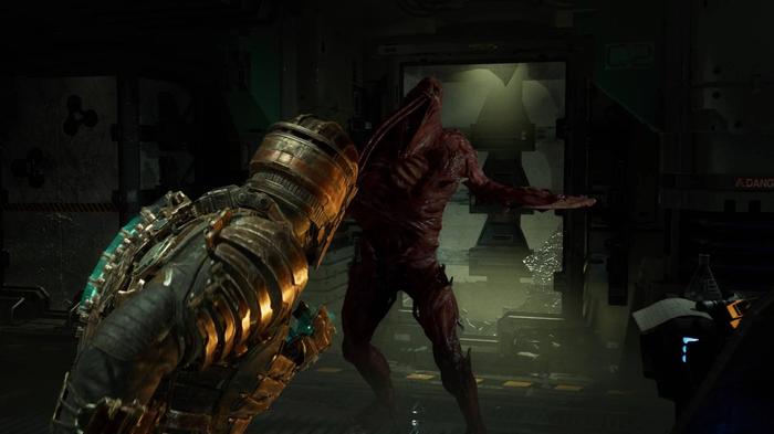 Isaac cowering from a necromorph in the Dead Space remake.
