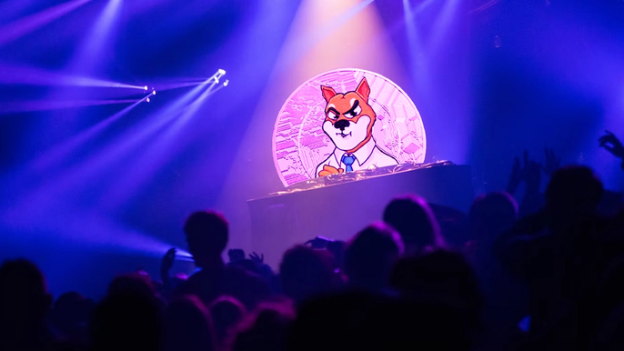 Nightclub with blue lights, with an audience looking at a Shiba Inu Coin behind a DJ set.