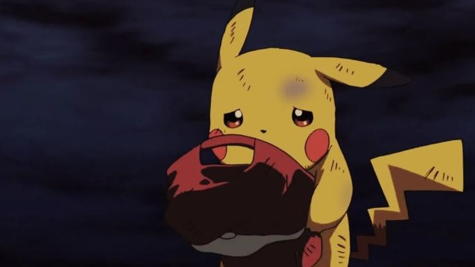 Pikachu is crying and holding Ash's hat