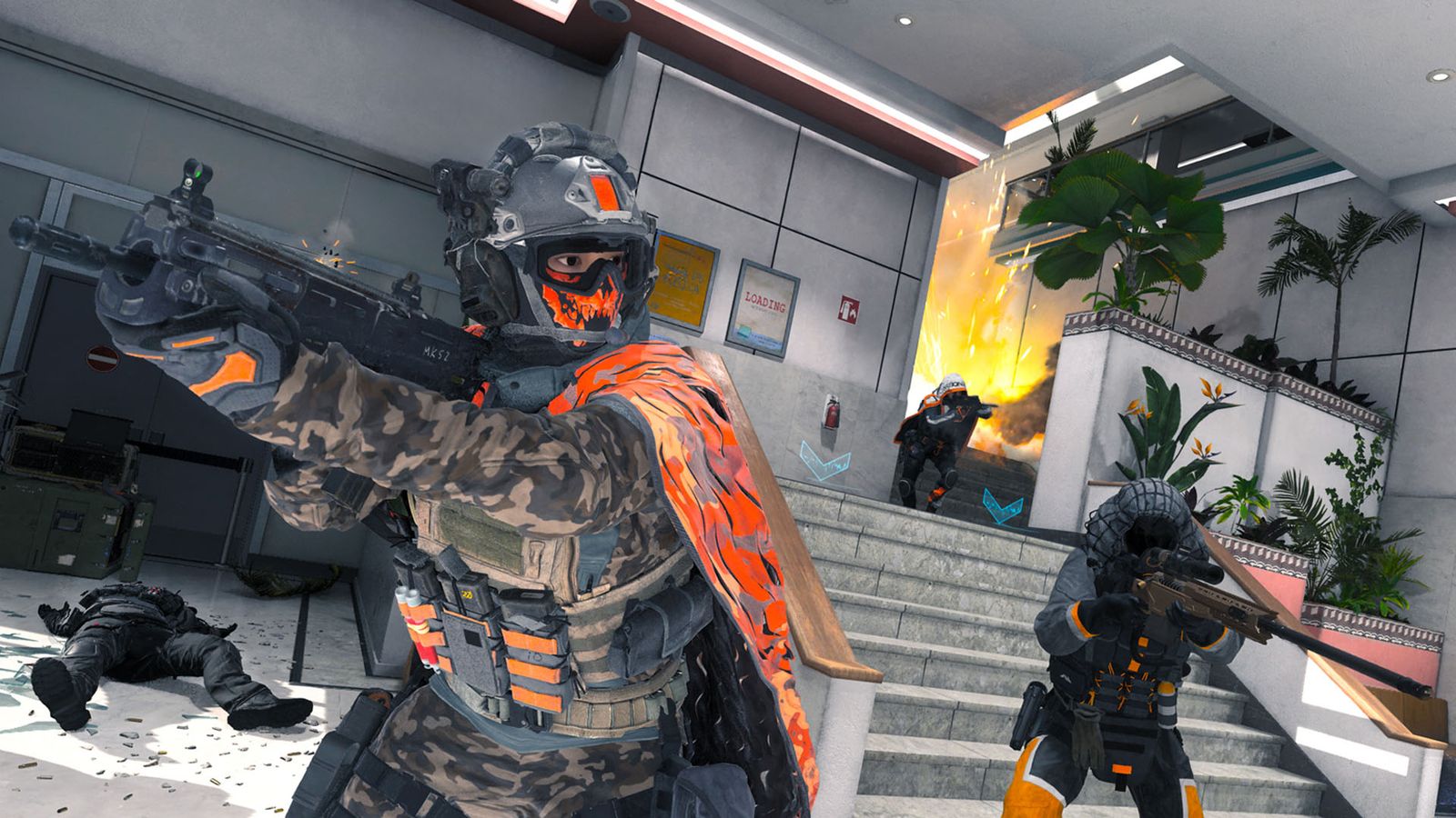 Modern Warfare 3 players guarding staircase while holding guns. An explosion is in the background