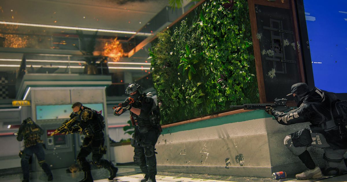 Modern Warfare 3 player crouching behind bush with enemies in background
