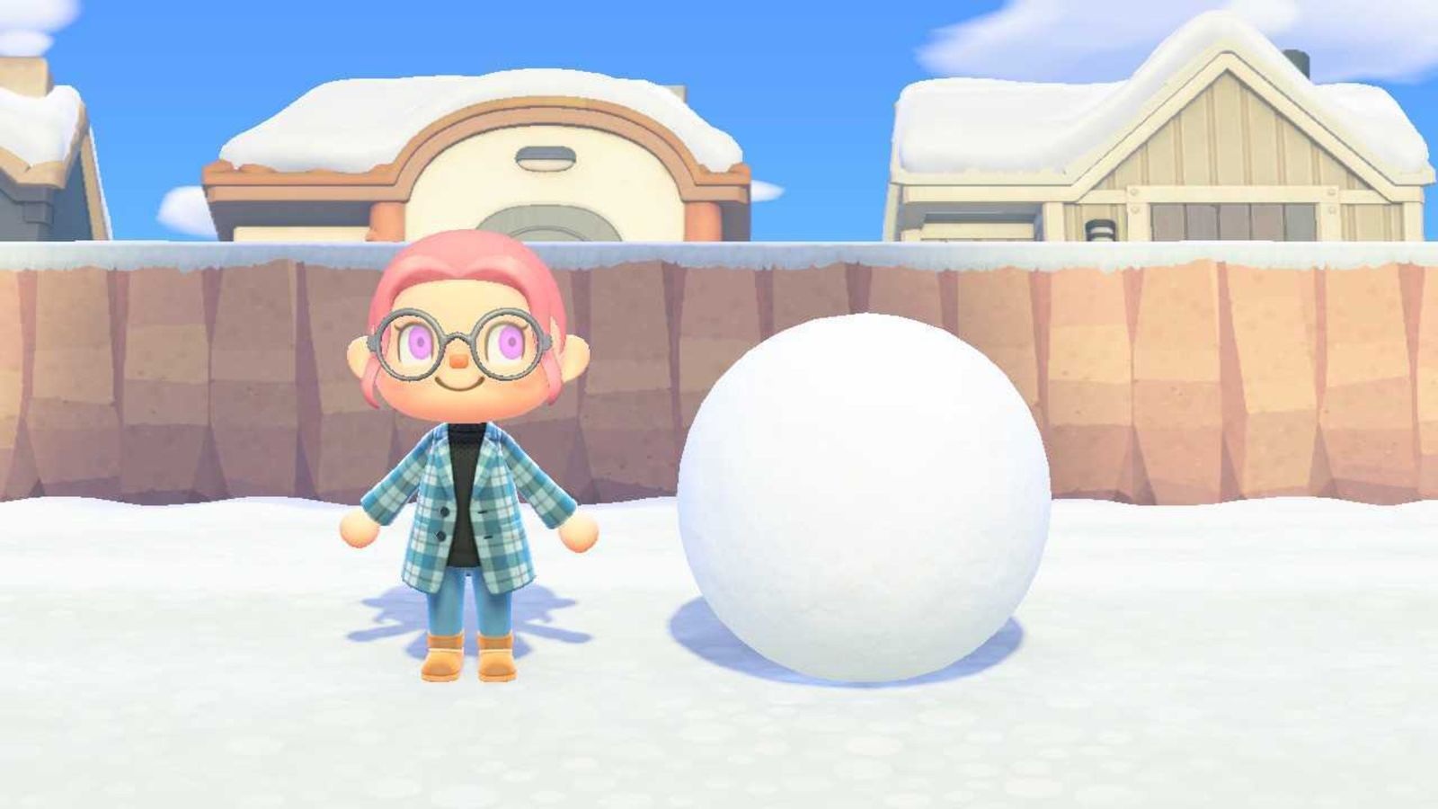 Animal Crossing New Horizons Character standing next to part one of a snowboy. A big snowball. 