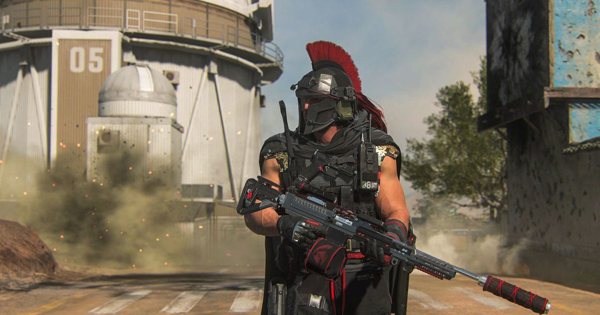 Screenshot of Warzone 2 Nickmercs Operator carrying gun in front of smoke in the background