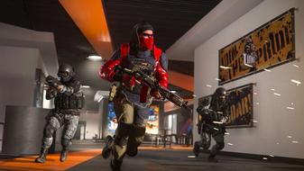 Screenshot of Warzone players running through a corridor carrying guns