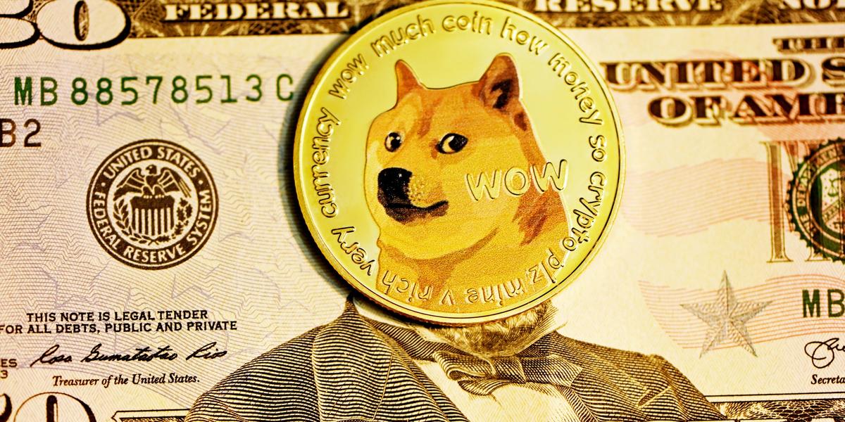 Dogecoin token on a fifty dollar note