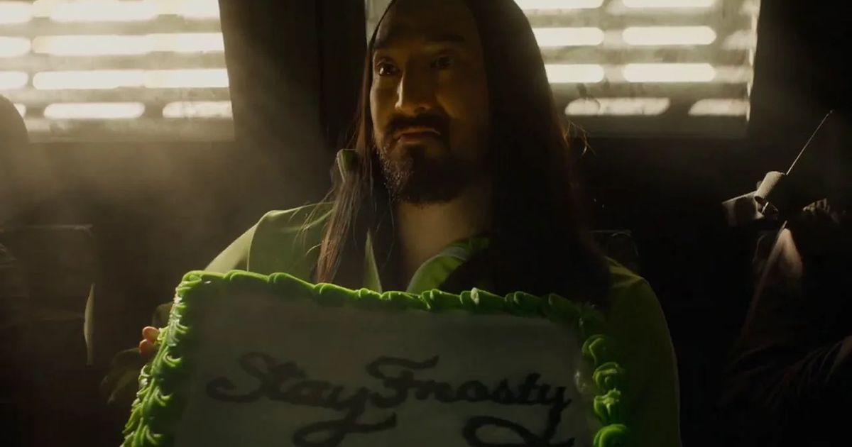 Image showing Steve Aoki holding a cake saying Stay Frosty