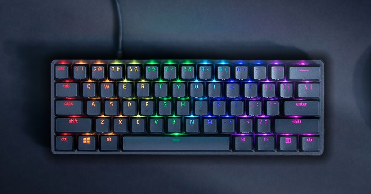 A small, compact, black keyboard with RGB lighting behind the keys.