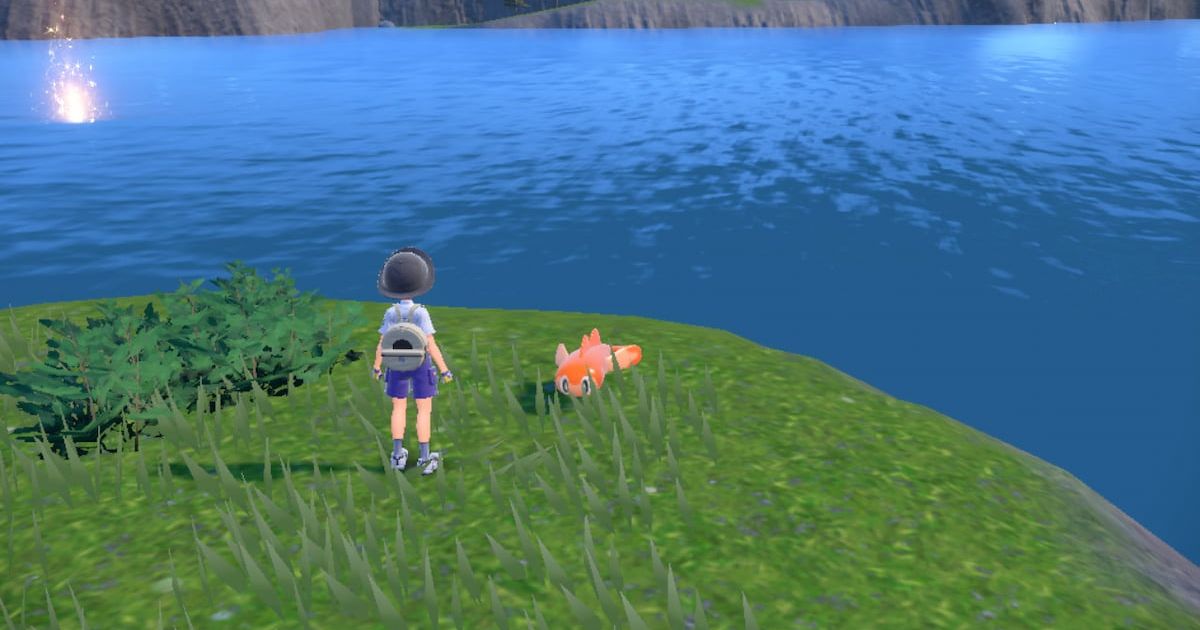 A Pokemon trainer stood by a lake in Pokemon Scarlet and Violet.