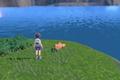 A Pokemon trainer stood by a lake in Pokemon Scarlet and Violet.