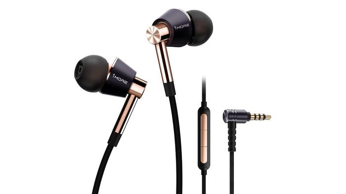 Best wired earbuds - 1more Triple Driver product image of a set of black and gold wired earbuds with onboard controls.