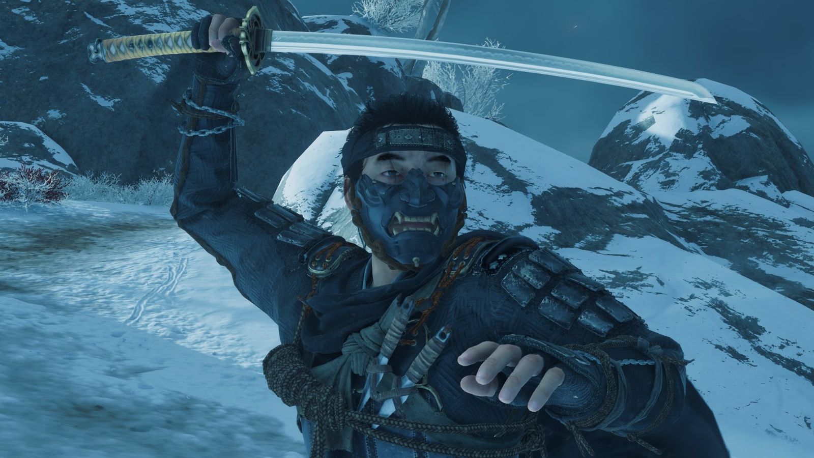 Jin Sakai wearing Ghost Armor and holding his sword in Water Pose in an icy landscape in Ghost of Tsushima photo mode