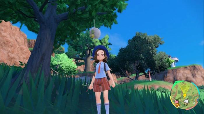 A Pokemon trainer walking through a grassy patch in Pokemon Scarlet and Violet.