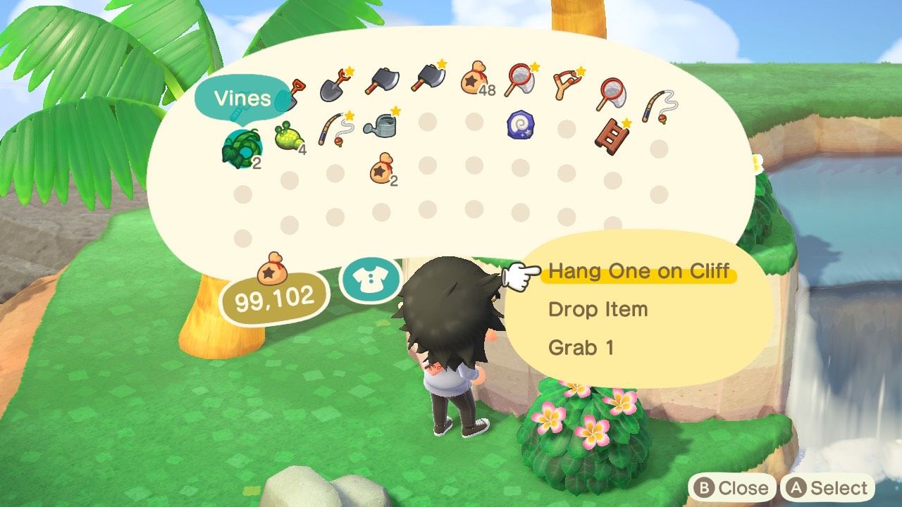 A player using a vine to hang on a cliff and climb it on a Kapp'n's Island Tour in Animal Crossing: New Horizons.