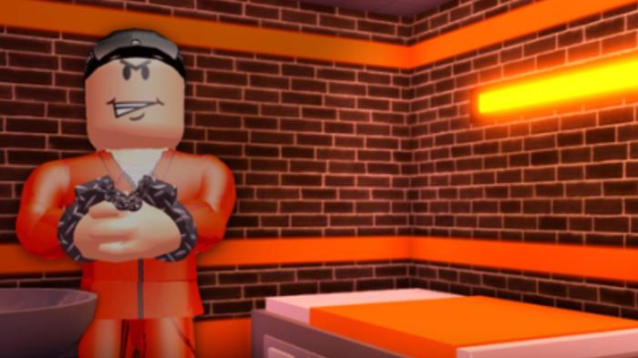Screenshot from Jailbreak, with an grinning criminal in handcuffs in their cell
