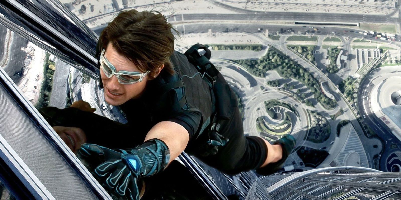 Tom Cruise hanging of the side of a building in Mission Impossible Ghost Protocol.